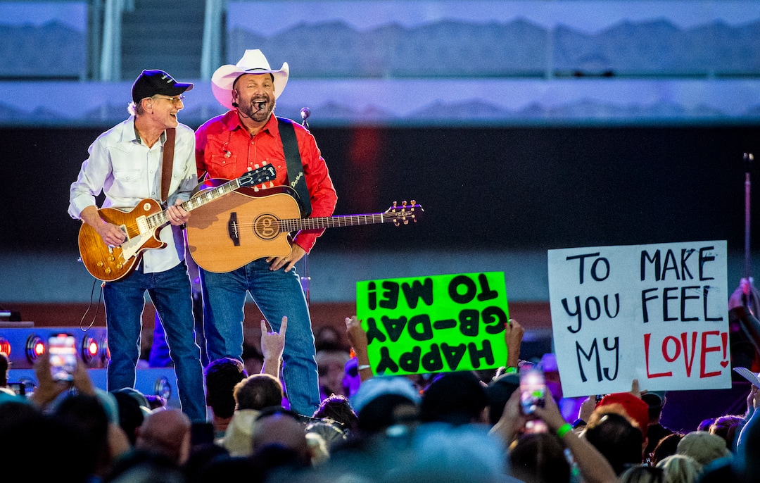 (Isaac Hale | Special to The Tribune) Garth Brooks wishes a fan happy birthday as he performs with his band during a stop on their stadium tour held at Rice-Eccles Stadium in Salt Lake City on Saturday, July 17, 2021.