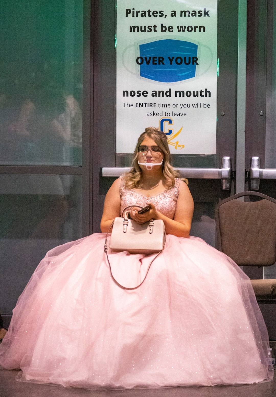 (Rick Egan | The Salt Lake Tribune)Emily Eggleston wears a face shield as she takes a break at the Cyprus High school Prom, at the Viridian Event Center, on Saturday, April 24, 2021.