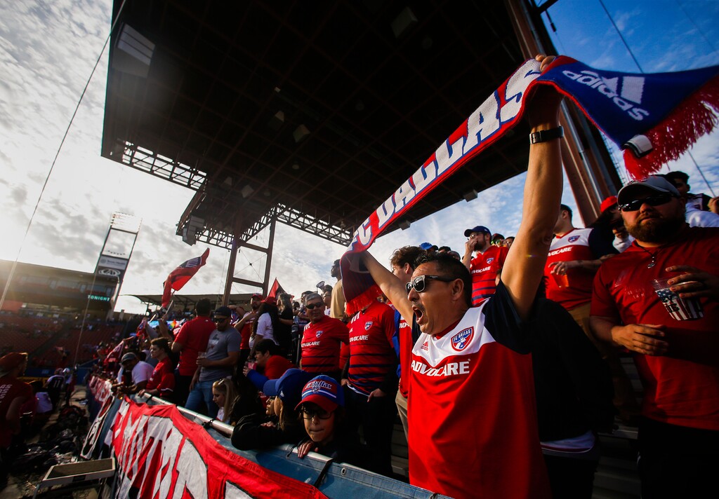 (Ryan Michalesko//The Dallas Morning News via AP, file) FC Dallas fans celebrate at the start of the team's MLS soccer match against Philadelphia Union on Saturday, Feb. 29, 2020, in Frisco, Texas.