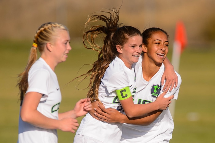 (Trent Nelson | The Salt Lake Tribune) Syracuse's Caroline Stringfellow (35, center) celebrates a goal with teammate Lexi Chenoweth in the Class 6A girls' soccer state quarterfinal between Pleasant Grove and Syracuse, in Syracuse Thursday October 12, 2017. Ashlyn Hall at left.