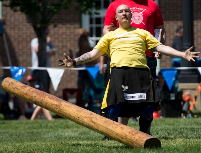 (Rick Egan  |  The Salt Lake Tribune)      Justin Lees competes in the caber toss, at the 44th annual Utah Scottish Festival and Highland Games at the Utah State Fairgrounds, Sunday, June 10, 2018.