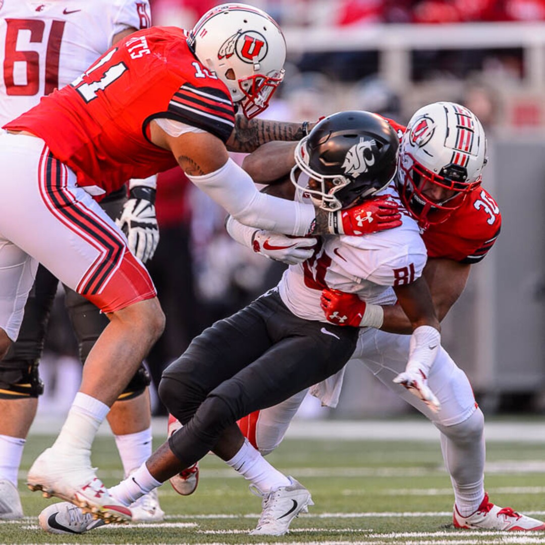 (Trent Nelson | The Salt Lake Tribune)  Utah Utes defensive end Kylie Fitts (11) and Utah Utes linebacker Cody Barton (30) bring down Washington State Cougars wide receiver Renard Bell (81) as the University of Utah hosts Washington State, NCAA football in Salt Lake City, Saturday November 11, 2017.