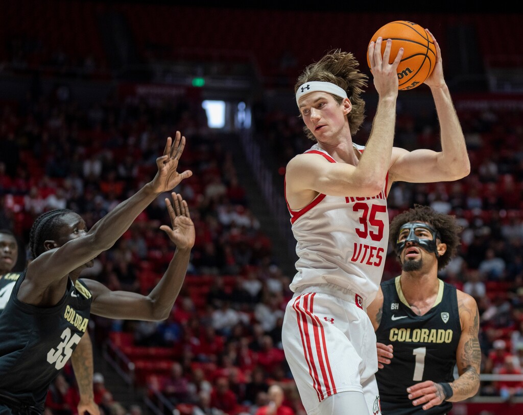 (Rick Egan | The Salt Lake Tribune) Utah Utes center Branden Carlson (35) is guarded by Colorado Buffaloes forward Assane Diop (35) and Colorado Buffaloes guard J'Vonne Hadley (1), in PAC-12 basketball action between the Utah Utes and the Colorado Buffaloes a the Jon M. Huntsman Center, on Saturday, Feb. 3, 2024.