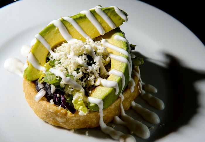 (Steve Griffin | The Salt Lake Tribune) The Sope Con Frijoles, Aguacate Y Queso (fresh masa some filled with seasoned black beans, avocado, salsa verde and quest fresco at Alamexo Cantina in Salt Lake City.
