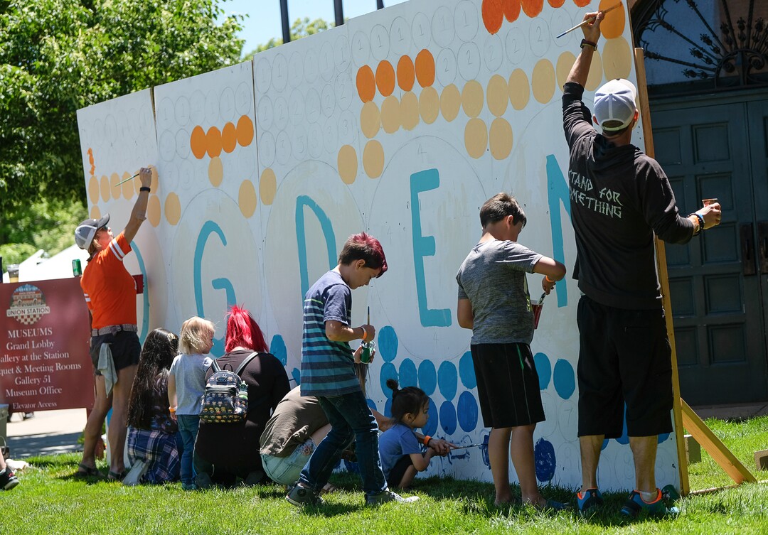 (Francisco Kjolseth  |  The Salt Lake Tribune)  People participate in the creation of a communal Ogden mural as the Ogden Arts Festival brings local and regional artists, creatives and entertainers to Ogden, UT on June 8th and 9th. The Ogden Arts Festival returned to the historic Union Station located in the heart of downtown. Managed by Nurture the Creative Mind and held as a fundraiser for the organization, the event was complete with artist booths, music, theater, kidÕs activities, urban arts area, skateboarding games and artisan food vendors.