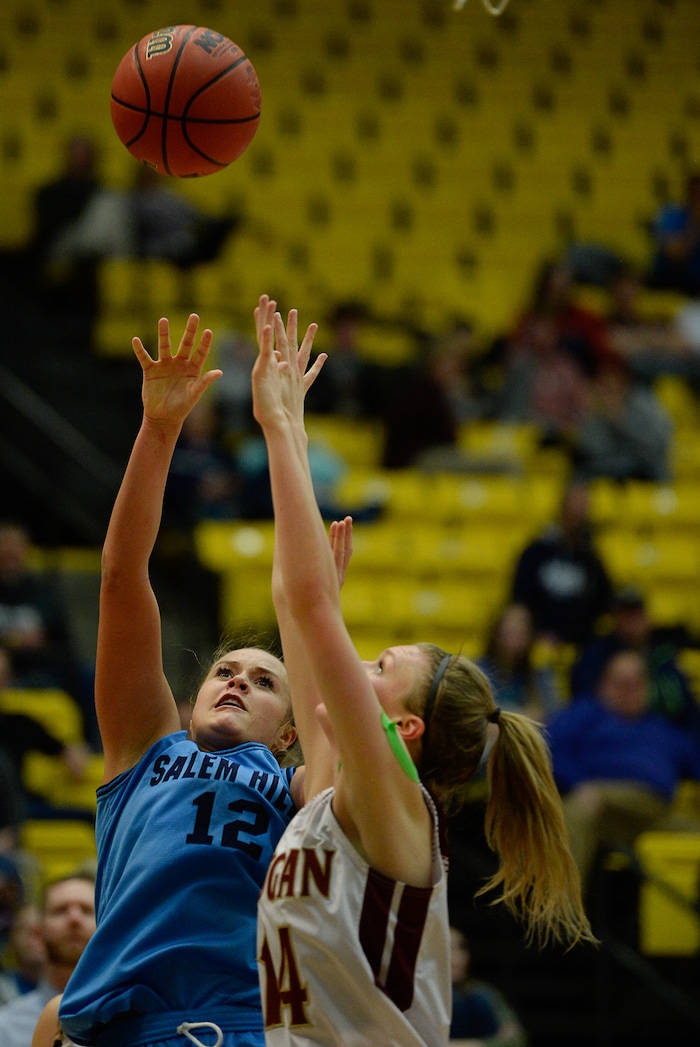 (Francisco Kjolseth  |  The Salt Lake Tribune)  Logan vs Salem Hills, 4A girls State high school semi finals basketball tournament at Utah Valley UniversityÕs UCCU Center, Friday March 2, 2018. Lauren Gustin (12) of Salem Hills battles Tori Craner (14) of Salem. 
