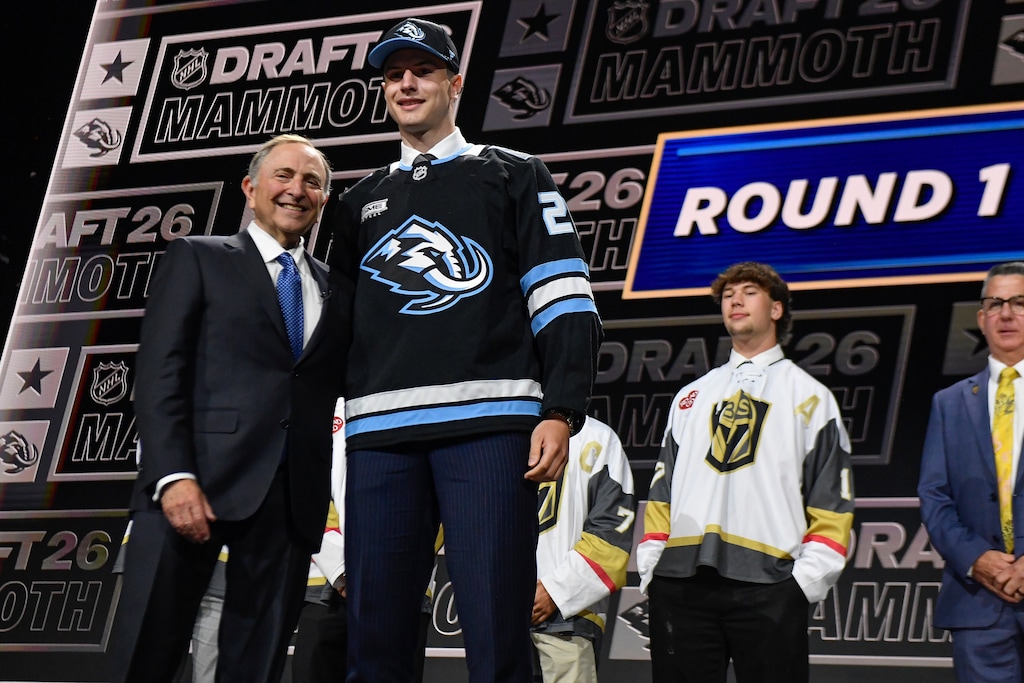 (Adrian Kraus | AP) Ethan Belchetz, right, stands with NHL Commissioner Gary Bettman after being drafted by the Utah Mammoth during the NHL hockey draft Friday, June 26, 2026, in Buffalo, N.Y.