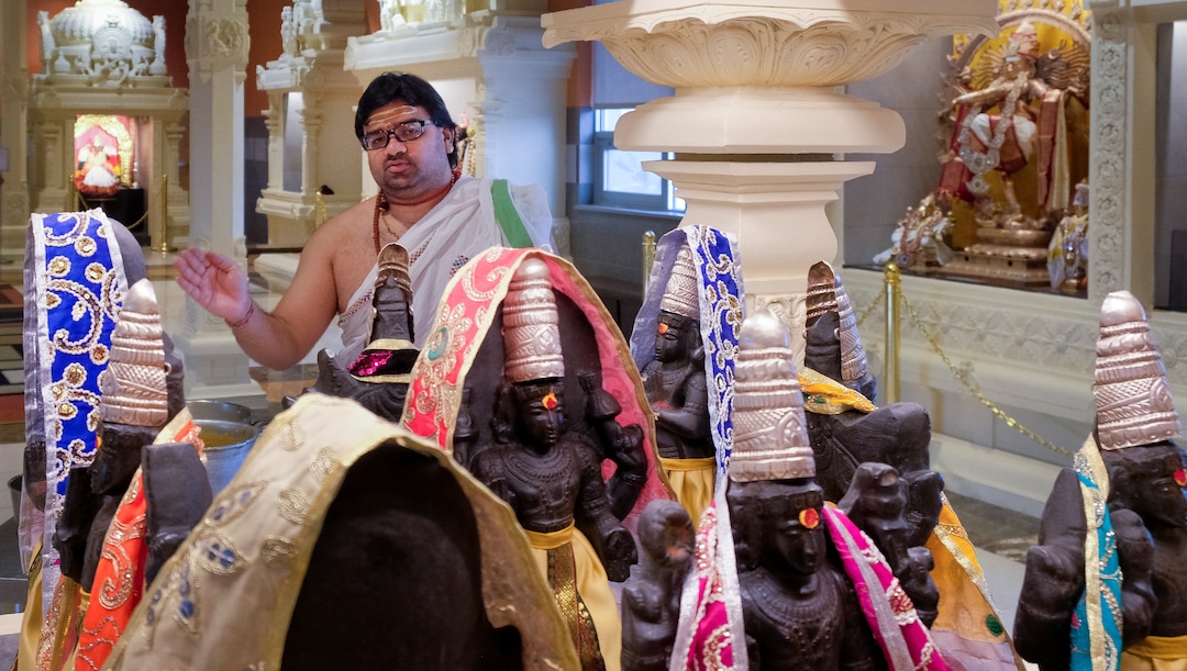 Leah Hogsten  |  The Salt Lake Tribune  Sri Ganesha Hindu Temple priest Sathish Nivarthi makes offerings to the planets of the Navagraha shrine, March 28, 2019. Hindu priests act as a kind of mediator between the worshipper and the deity, performing rituals to the deities on behalf of the worshippers. Artisans from around the world spent two years hand-carving deities in the Sri Ganesha Hindu Temple in South Jordan. 