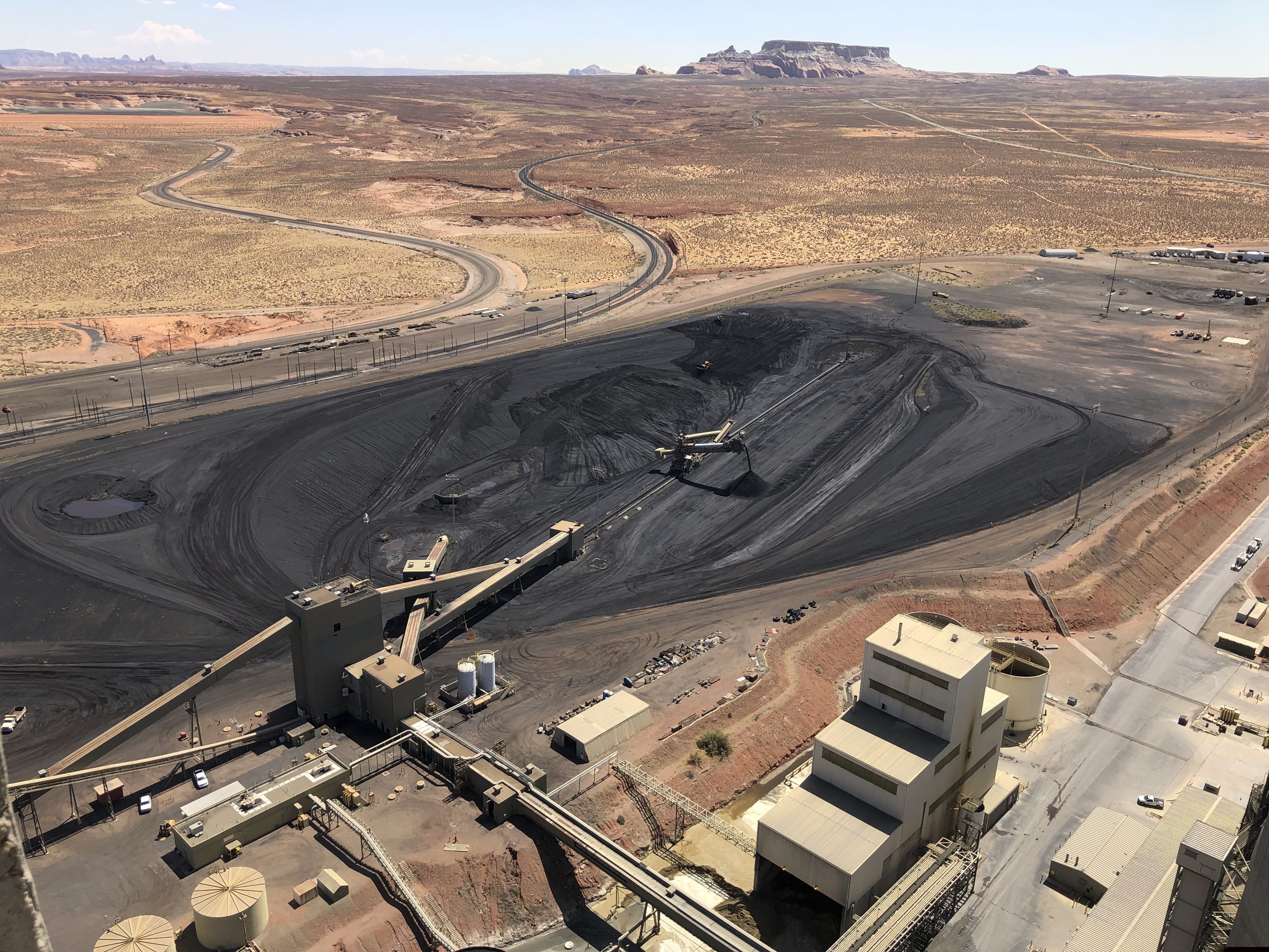 (Susan Montoya Bryan | AP file photo) This Aug. 20, 2019, file photo, shows the coal stockpile at the Navajo Generating Station near Page, Ariz. Coal-fired power plants and mines have been huge economic drivers in the Four Corners region for decades. The Navajo Generating Station near Page and its feed mine shut down last year. The San Juan Generating Station near Farmington, N.M., is scheduled to shutter in 2022 and the nearby Four Corners Power Plant in 2031.