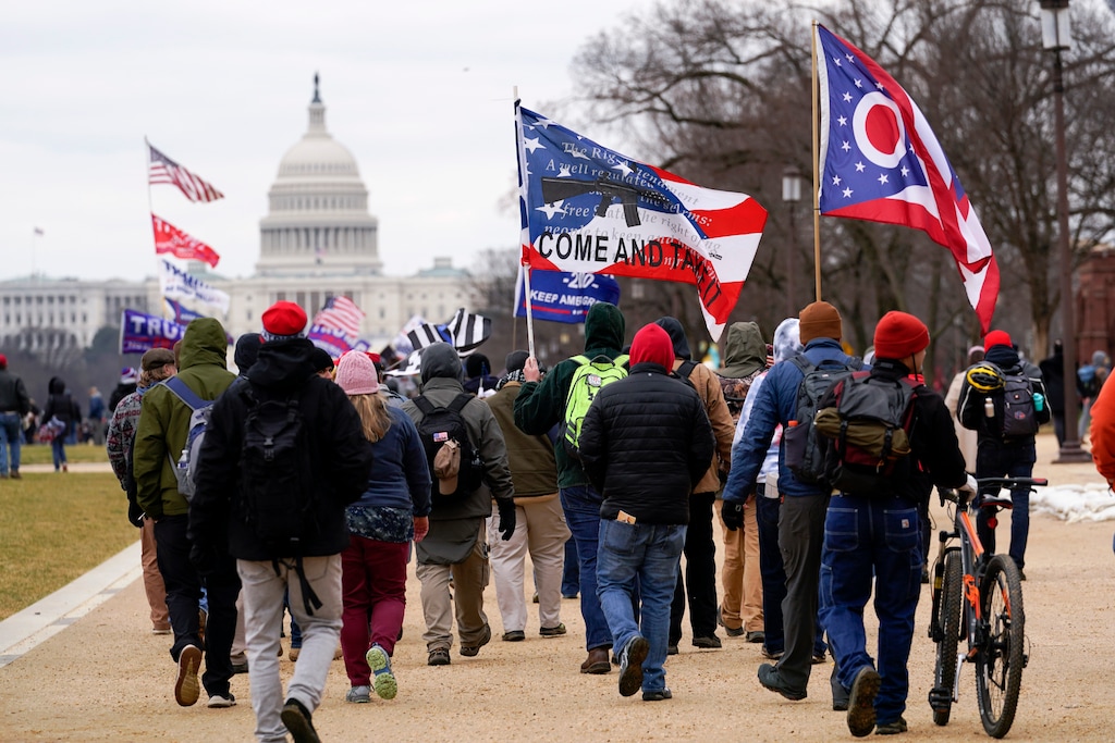 (Carolyn Kaster | AP photo)
In this Jan. 6, 2021, photo, supporters of President Donald Trump march towards the Capitol holding flags during rally in Washington. War-like imagery has begun to take hold in mainstream Republican political circles in the wake of the deadly attack on the U.S. Capitol, with some elected officials and party leaders rejecting calls to tone down their rhetoric contemplating a second civil war.