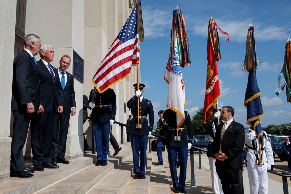 Vice President Mike Pence, center, is greeted by Deputy Secretary of Defense Pat Shanahan, right, and Secretary of Defense Jim Mattis before speaking at an event on the creation of a United States Space Force, Thursday, Aug. 9, 2018, at the Pentagon. (AP Photo/Evan Vucci)