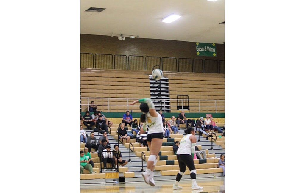 (Kearns High) Jaymohlynn, a student at Kearns High, is shown serving in a volleyball game against West Jordan in September 23, 2025.