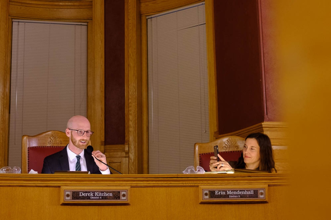 (Trent Nelson | The Salt Lake Tribune)  Outgoing Salt Lake City Council Member Derek Kitchen gives his farewell marks at the council meeting on Tuesday Nov. 27, 2018. At right, Erin Mendenhall takes a photo, and at left is Chris Wharton.
