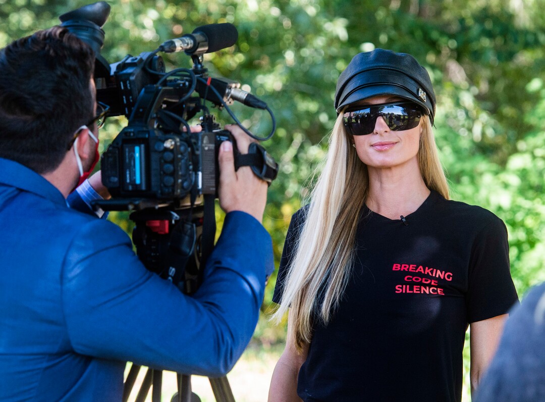 (Rick Egan  |  The Salt Lake Tribune)    Paris Hilton is interview by the local media, during a rally calling for the closure of Provo Canyon School, a residential treatment center in Utah she attended when she was a teen, on Friday, Oct. 9, 2020.