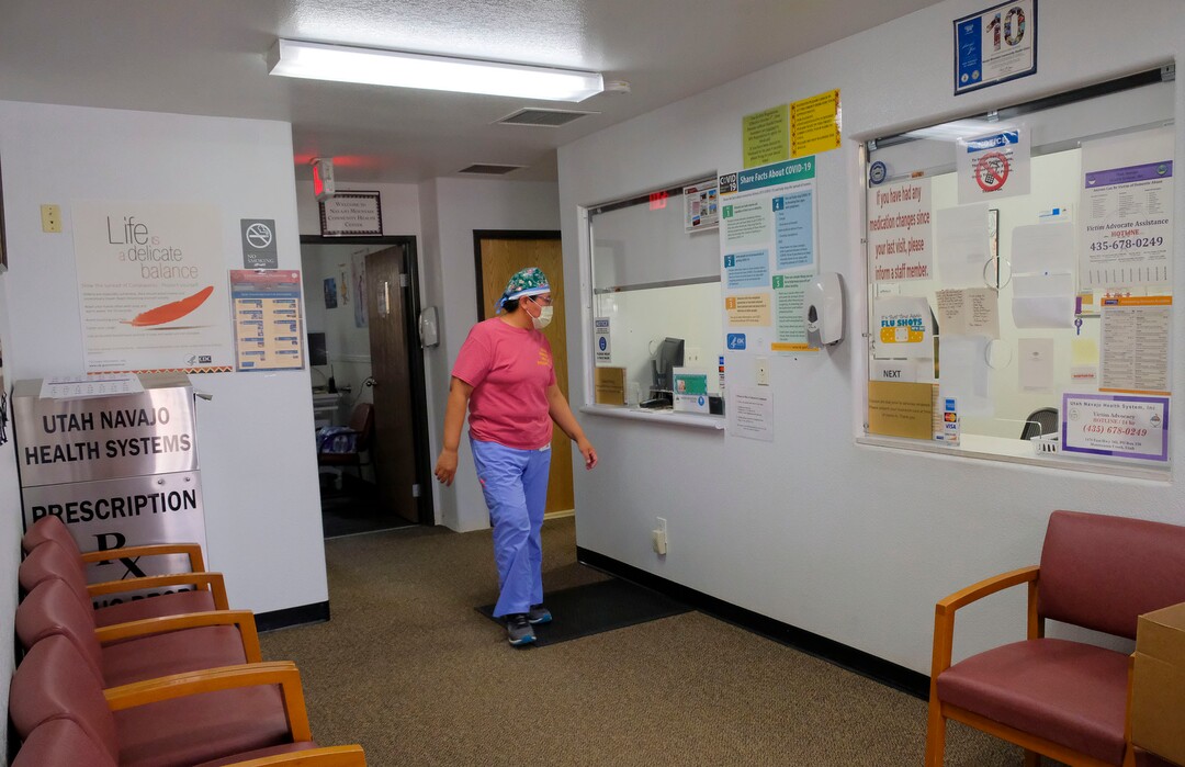 (Leah Hogsten  |  The Salt Lake Tribune) Navajo Mountain Clinic Manager Revina Talker walks through the clinic’s waiting area now closed to patients, Aug., 25, 2020. “We can’t let our guard down,” said Talker of the clinic’s response to the pandemic in the small community as flu season and fall approach. “I think we’re going to have to get ready for the next round.”