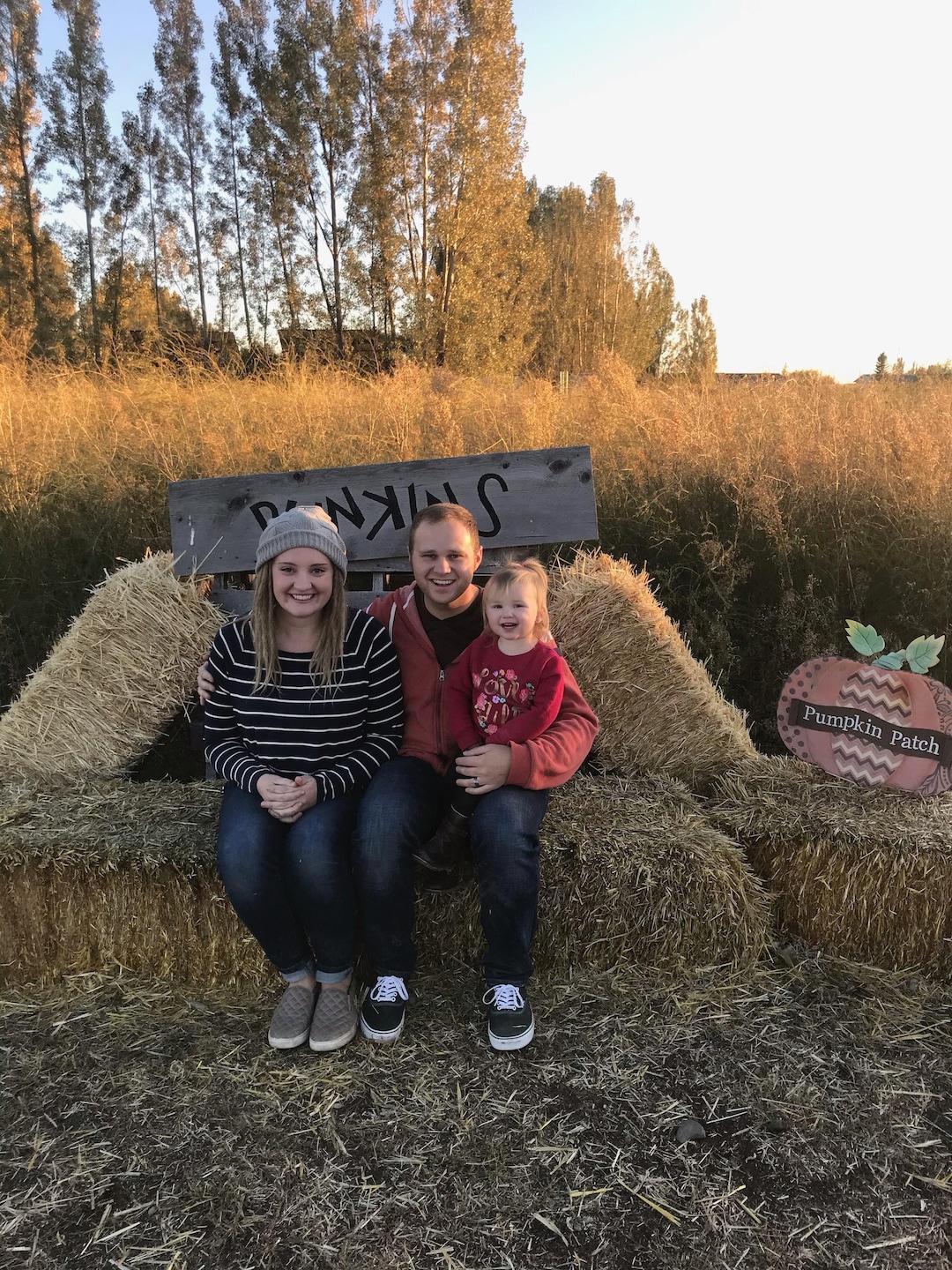 (Photo courtesy of Tanner Emerson) Pictured is Tanner Emerson and his wife, Amanda, holding their daughter.