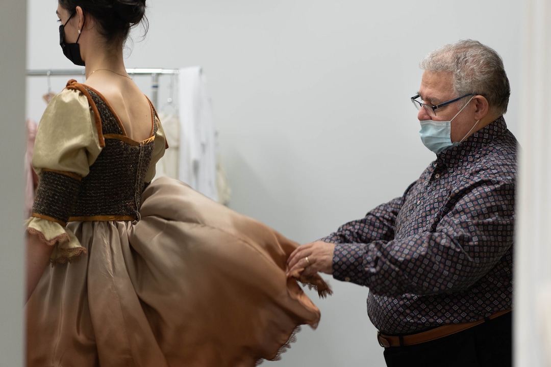 (Francisco Kjolseth | The Salt Lake Tribune) David Heuvel, the retiring director of costume production at Ballet West, who has spent five decades in the arts industry, helps a dancer with a fitting for his final hurrah designing outfits for Romeo and Juliet on Thursday, Feb. 3, 2022.