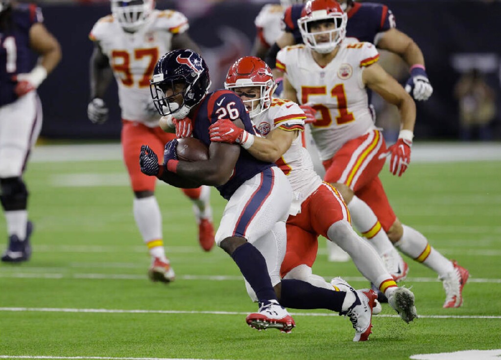 David J. Phillip | The Associated Press. Houston Texans running back Lamar Miller (26) is hit by Kansas City Chiefs strong safety Daniel Sorensen (49) on a run during the second half of an NFL football game, Sunday, Oct. 8, 2017, in Houston.