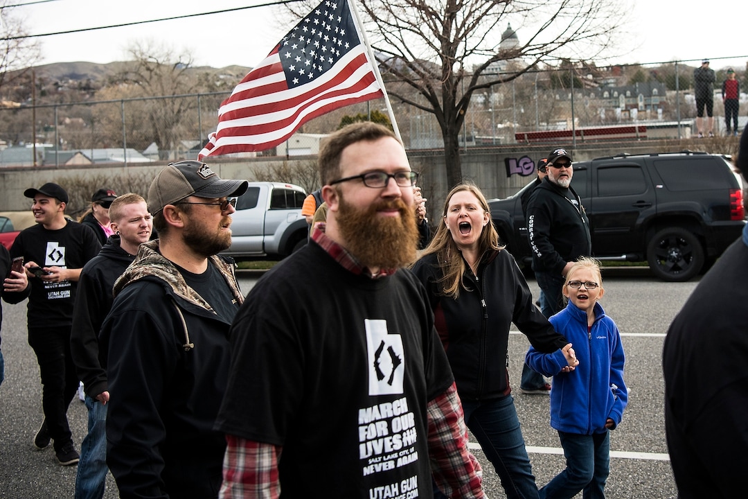 (Chris Detrick | The Salt Lake Tribune) Participants hold signs during the March Before Our Lives rally near West High School in Salt Lake City Saturday, March 24, 2018.