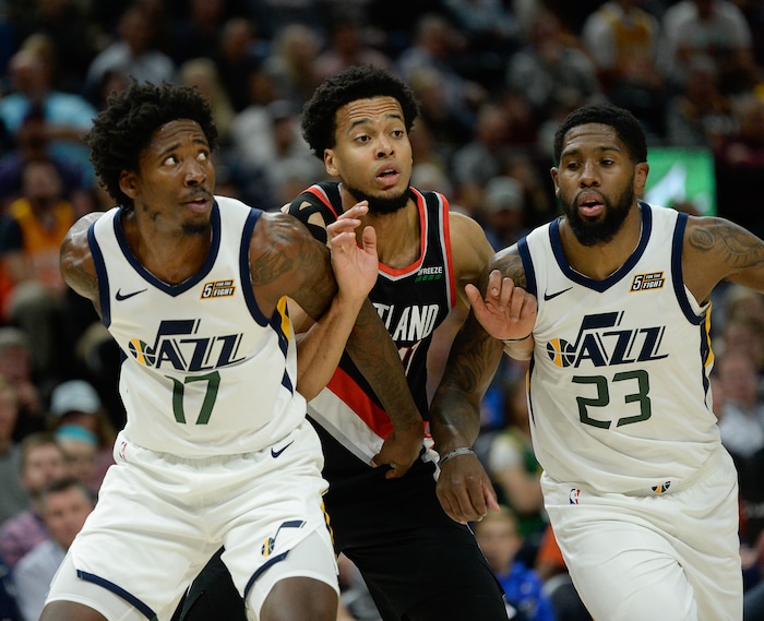 (Francisco Kjolseth  |  The Salt Lake Tribune)  Portland Trail Blazers forward Skal Labissiere (17) is sandwiched by Utah Jazz center Ed Davis (17) and Utah Jazz forward Royce O'Neale (23) as the Utah Jazz host the Portland Trailblazers in their NBA basketball game at Vivint Smart Home Arena in Salt Lake City on Wed. Oct. 16, 2019.