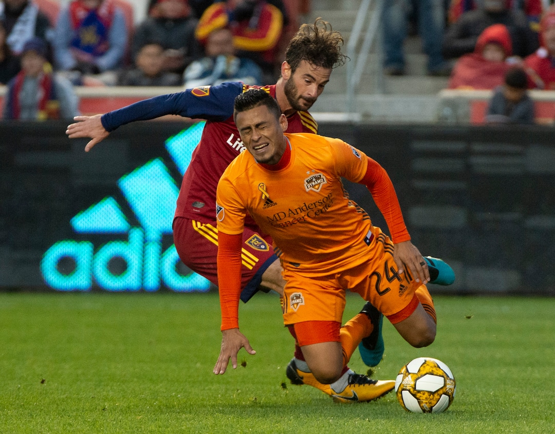 (Rick Egan  |  The Salt Lake Tribune)      Houston Dynamo midfielder Darwin Ceren (24) hits the ground after colliding with Real Salt Lake midfielder Kyle Beckerman (5), in MLS soccer action, between Real Salt Lake and Houston Dynamo, at Rio Tinto Stadium, Sunday, Sept. 29, 2019.