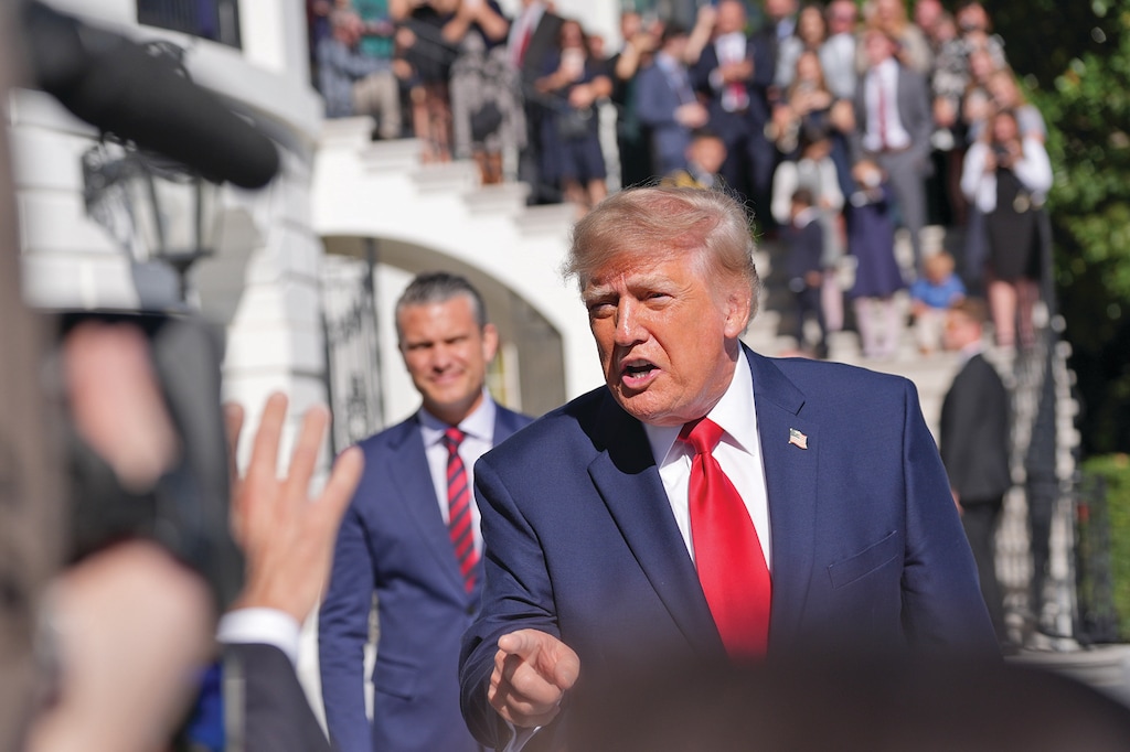 President Donald Trump speaks with reporters before departing on Marine One from the South Lawn of the White House, Tuesday, Oct. 6, 2026, in Washington. (AP Photo/Alex Brandon)