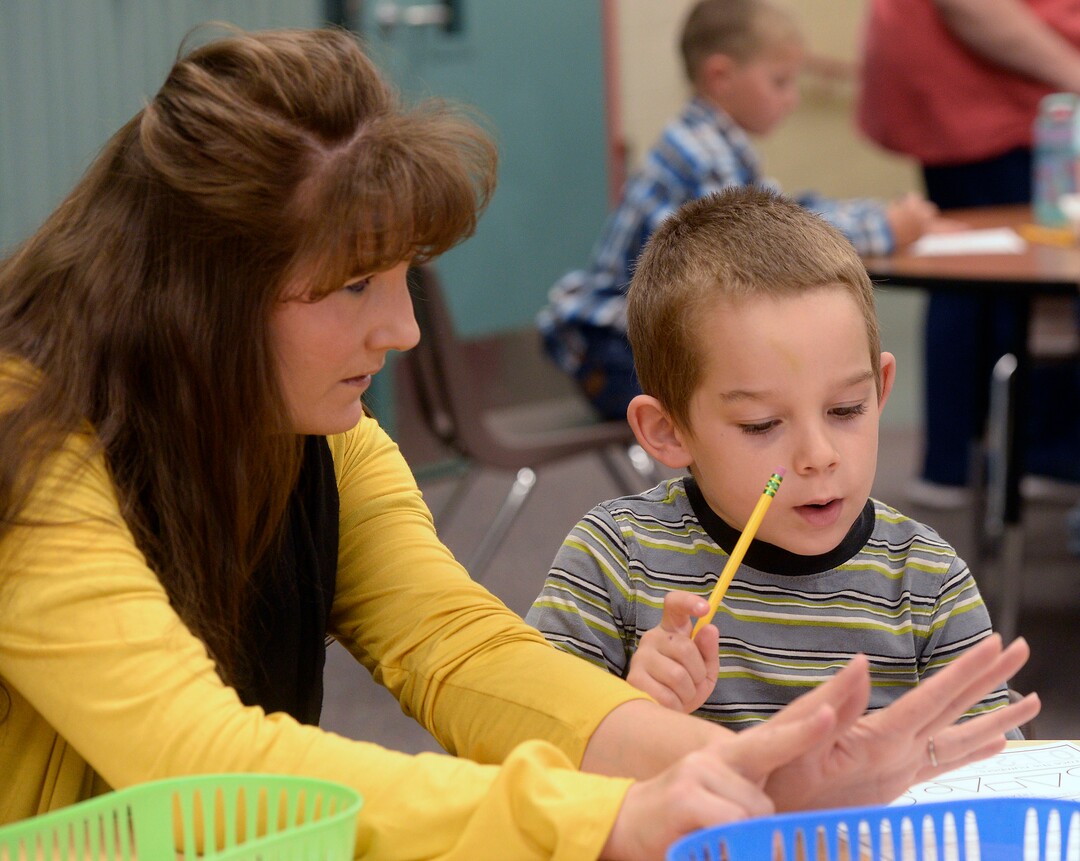 (Al Hartmann  |  The Salt Lake Tribune)  Melissa Morris is of two full-time teachers at Park Valley School, Here, she works with Jacob Green on his counting skills Wednesday August 30.