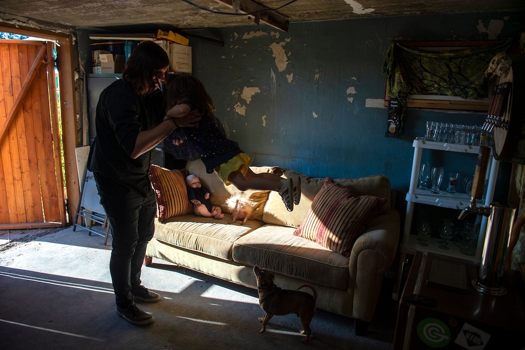 (Leah Hogsten  |  The Salt Lake Tribune)   Landon Jeffery swings his daughter Vivenne, 4, as his son Byron, 5mos., relaxes on the couch in the basement where Jeffery brews beer once a week. Jeffery was named Utah's "Best Home Brewer" during the 2019 Beehive Brewoff. Jeffery earned five gold medals, three silver and a bronze, including the "best beer." The win is good news for Ogden beer drinkers Ñ as Jeffery will become a co-brewer at Ogden River Brewing, when it opens early next year.