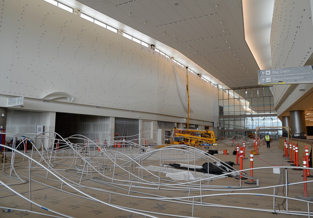 (Francisco Kjolseth  |  The Salt Lake Tribune) The area known as The Canyon begins to take shape with crews stretching fabric over metal fins to simulate southern Utah canyon walls during the first phase of construction of the Salt Lake City International Airport on Wednesday, May 20, 2020.