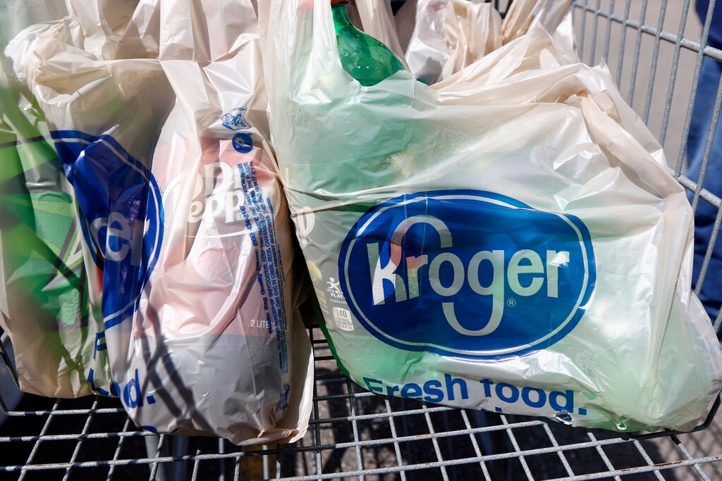 (Rogelio V. Solis | The Associated Press) This June 15, 2017, file photo shows bagged purchases from the Kroger grocery store in Flowood, Miss. The nation’s largest grocery chain will phase out the use of plastic bags in its stores by 2025.