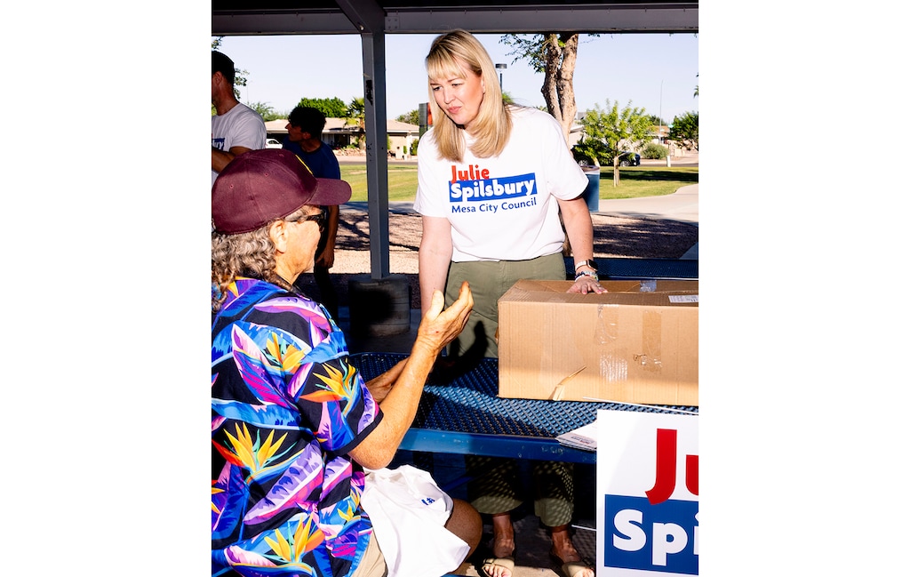 (Cassidy Araiza | The New York Times) Mesa City Council member Julie Spilsbury campaigns in October. 