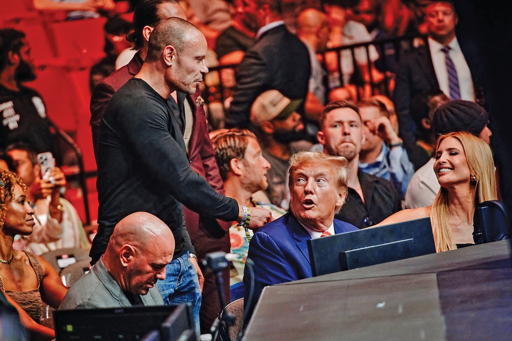 Dan Bongino, whose channel on Rumble was the most-watched livestream by a political commentator during the presidential debate, greets former President Donald Trump and daughter Ivanka at an Ultimate Fighting Championship event in Miami, Fla., March 9, 2024. (Scott McIntyre/The New York Times)