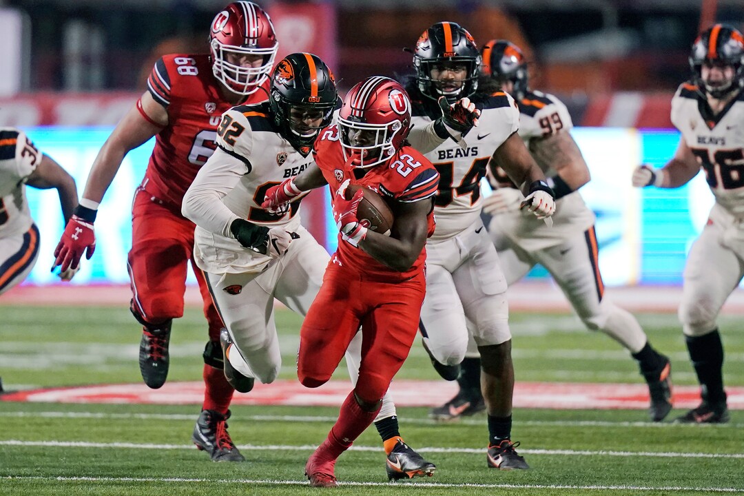 (Rick Bowmer | AP file photo) . Utah running back Ty Jordan (22) carries the ball against Oregon State during the first half of an NCAA college football game Saturday, Dec. 5, 2020, in Salt Lake City. Jordan died this week in Texas. Jordan died this week in Texas.