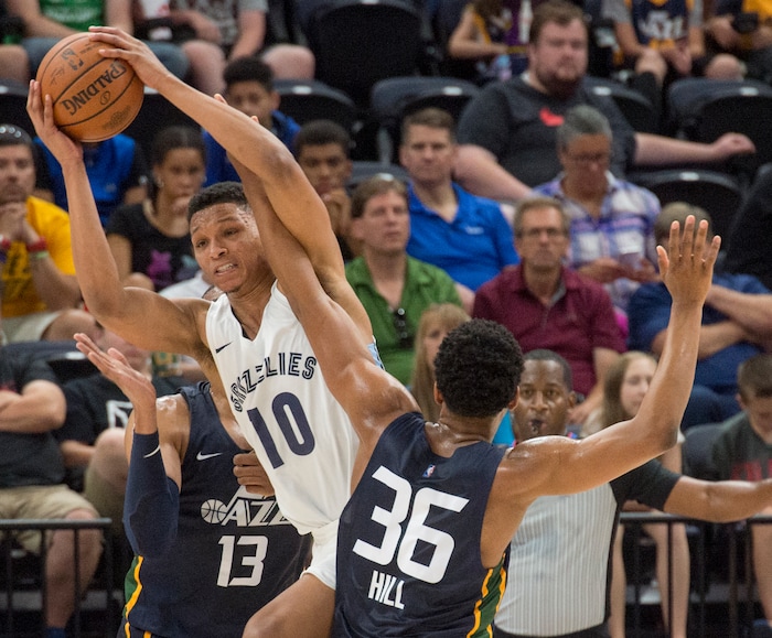 (Rick Egan  |  The Salt Lake Tribune)      Memphis Grizzlies forward Ivan Rabb (10) is guarded by Utah Jazz guard Malcolm Hill (36), in Utah Jazz summer league action between Utah Jazz and Memphis Grizzlies in Salt Lake City, Tuesday, July 3, 2018.