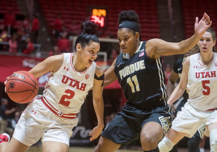 (Rick Egan  |  The Salt Lake Tribune)  Utah Utes guard Tori Williams (2) drives inside with the ball, as Purdue Boilermakers guard Dominique Oden (11) defends, in basketball action Utah Utes vs. Purdue Boilermakers, at the Jon M. Huntsman Center, Monday, Nov. 20, 2017.