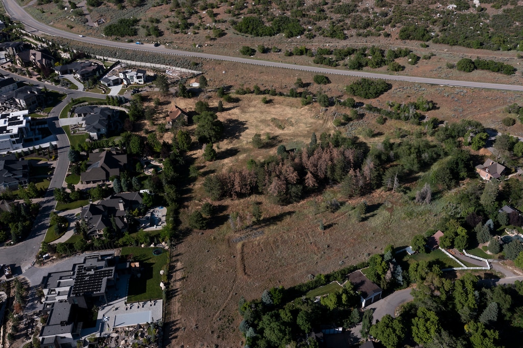 (Bethany Baker | The Salt Lake Tribune) A parcel of land is seen near the road In Cottonwood Heights on Friday, June 5, 2026. UDOT recently closed on the purchase of the land, which would be used for the Little Cottonwood Canyon gondola if the gondola is built.