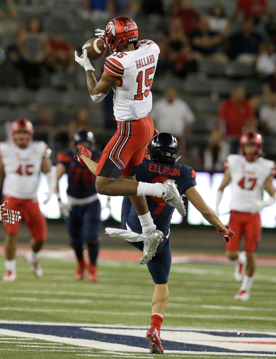 Utah defensive back Corrion Ballard (15) intercepts the ball intended for Arizona wide receiver Tony Ellison (9) in the second half during an NCAA college football game, Friday, Sept. 22, 2017, in Tucson, Ariz. Utah defeated Arizona 30-24. (AP Photo/Rick Scuteri)