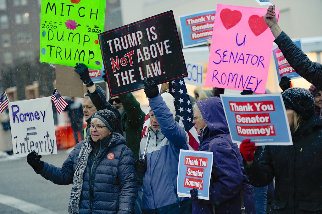 (Francisco Kjolseth | Tribune file photo) In this Feb. 5, 2020, file photo, people gather in support of Sen. Mitt Romney, R-Utah, at the Wallace F. Bennett Federal Building in Salt Lake City on Wednesday after he voted to convict President Donald Trump of abuse of power. The Utah senator was the only Republican to vote guilty on the first article of impeachment.