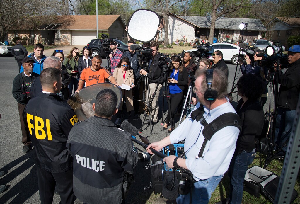 (Ricardo B. Brazziell | Austin American-Statesman via AP) Authorities speak to the media after multiple explosions in Austin on Monday, March 12, 2018. Police are responding to another explosion Monday, that badly injured a woman, hours after a package bomb killed a teenager and wounded a woman in a different part of the city.