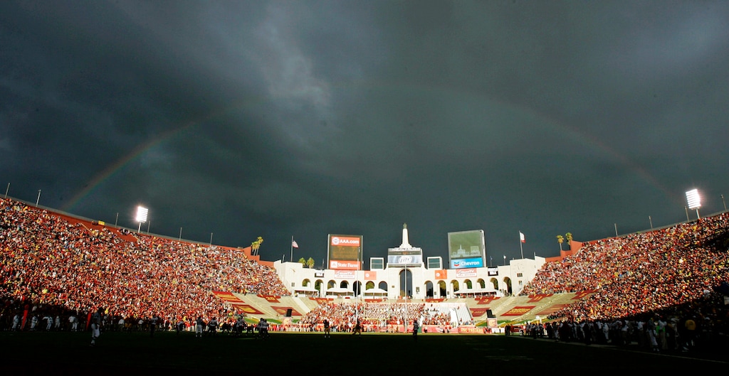 (Chris Carlson | AP File Photo) In this Sept. 22, 2007 photo, a rainbow forms over the Los Angeles Memorial Coliseum during the Southern California and Washington State NCAA college football game in Los Angeles. The Utah Utes will play against USC on Friday, Sept. 20, 2019. They have never won a game in the stadium.
