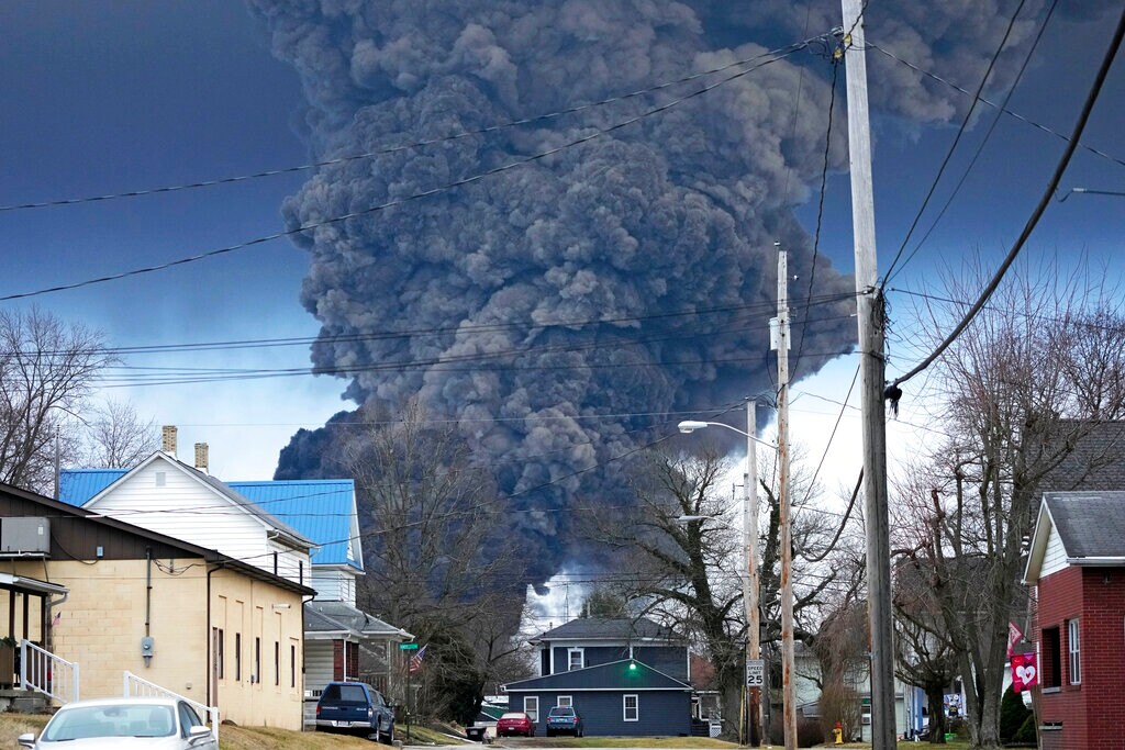 (Gene J. Puskar | AP) A black plume rises over East Palestine, Ohio, as a result of a controlled detonation of a portion of the derailed Norfolk Southern trains Monday, Feb. 6, 2023.