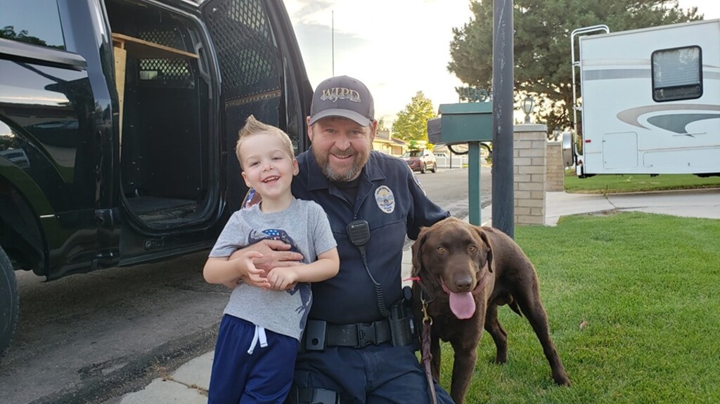 (Photo courtesy West Jordan Police Department) Talon, West Jordan Police officer Tom Smith and Beau — the dog who quickly found the not-so-missing boy.