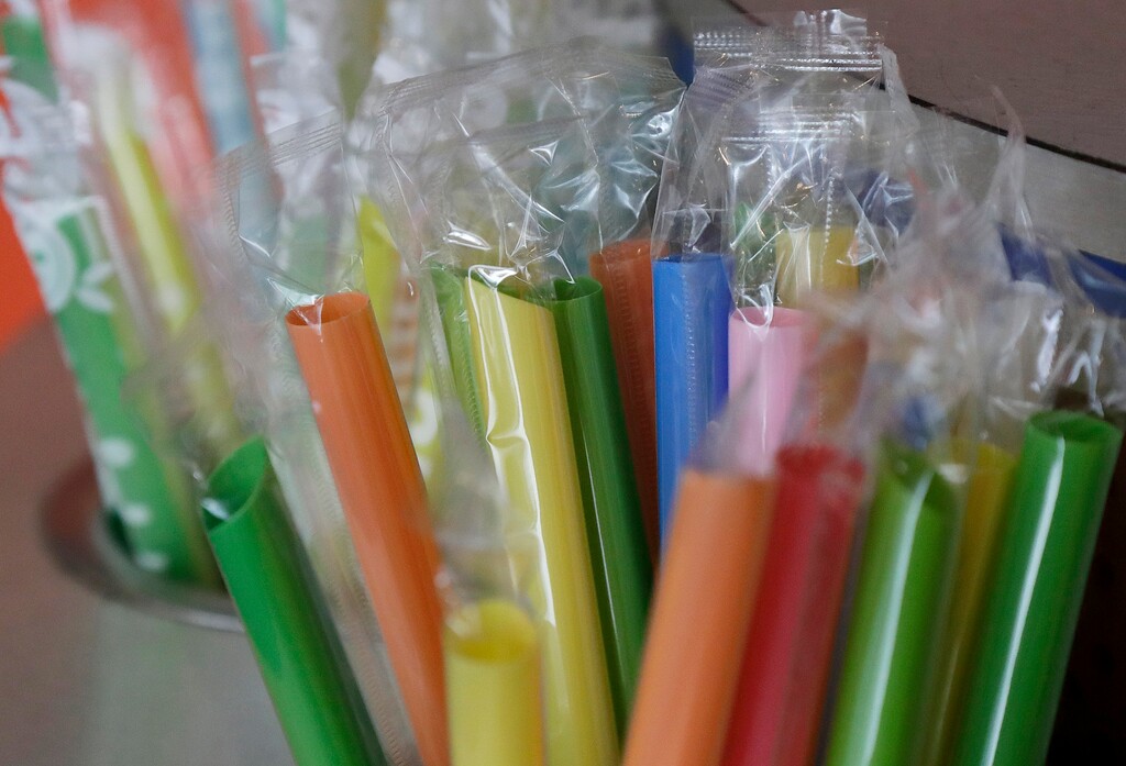 (Jeff Chiu | AP file photo) This July 17, 2018 file photo shows wrapped plastic straws at a bubble tea cafe in San Francisco. Whether to ban plastic straws has become a flash point among presidential candidates.