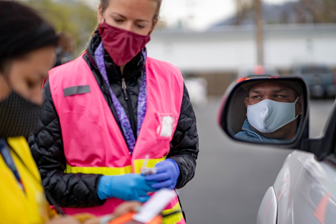 (Francisco Kjolseth | The Salt Lake Tribune) Mari Lujan, left, and Rachelle Peltier with the Salt Lake County Health Department prepare to vaccinate Oscar Hernandez-Diaz during a COVID-19 vaccination clinic offered to the Hispanic community at 339 East 3900 South in Salt Lake City, on Saturday, April 24, 2021, in collaboration with Clinica de Salud EZ.