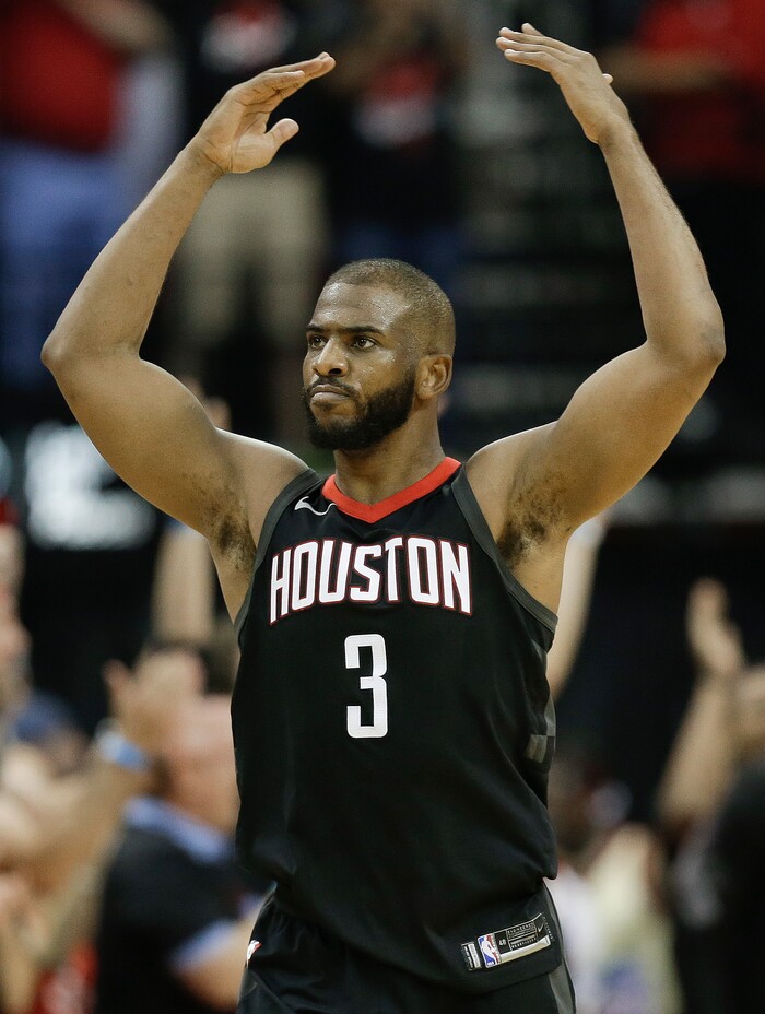 Houston Rockets guard Chris Paul reacts after a 3-pointer by PJ Tucker during the second half in Game 5 of an NBA basketball second-round playoff series against the Utah Jazz, Tuesday, May 8, 2018, in Houston. (AP Photo/Eric Christian Smith)