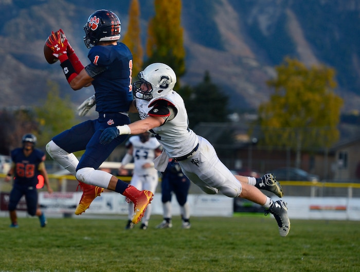 (Scott Sommerdorf  |  The Salt Lake Tribune)  Brighton WR Simi Fehoko catches this pass during second half play. Brighton beat Syracuse 35-14 in a 5A first-round playoff game at Brighton, Friday, October 31, 2014.