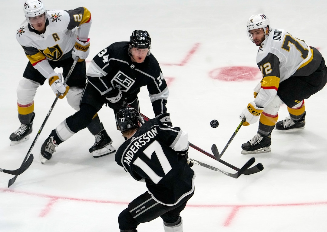 (Leah Hogsten | The Salt Lake Tribune)  Los Angeles Kings left wing Arthur Kaliyev (34) battles Vegas Golden Knights defenseman Zach Whitecloud (2) and Vegas Golden Knights center Gage Quinney (72) as the Los Angeles Kings and Vegas Knights meet in a preseason game at Vivint Arena on Sept. 30, 2021.
