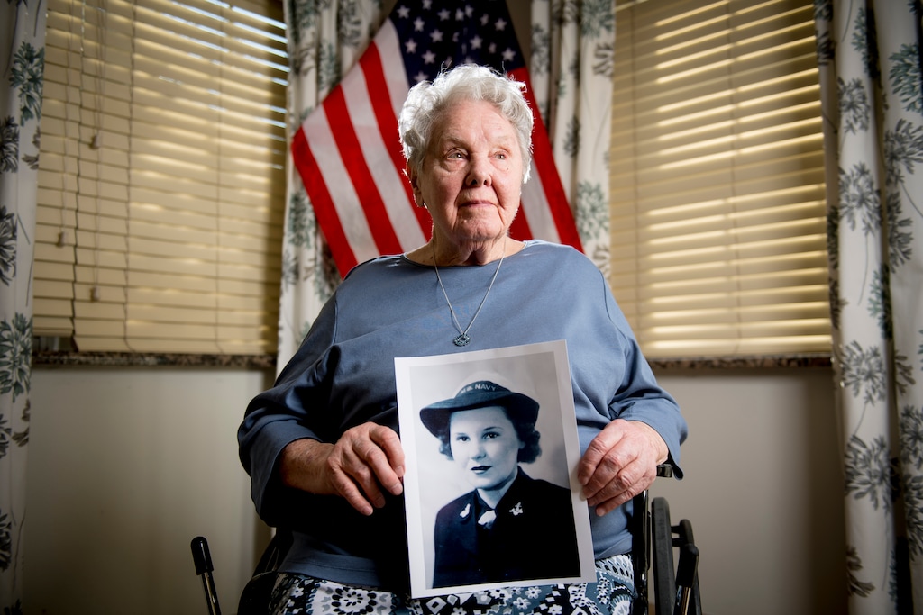 (Isaac Hale | The Daily Herald via AP) In this Wednesday, Feb. 19, 2020 photo, Olive O'Mara, a veteran who served as an engineer on a naval ship as part of the U.S. Navy's WAVES program during World War II, poses for a portrait at River Meadows Senior Living in Alpine, Utah. O'Mara was born on Saturday, Feb. 21, 1920.