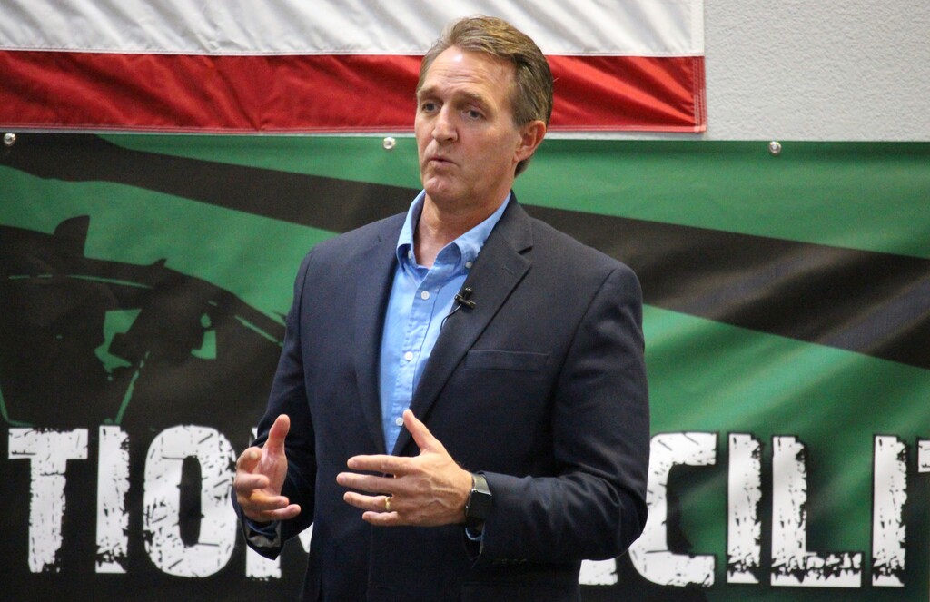 (Bob Christie | The Associated Press) U.S. Sen. Jeff Flake, R-Ariz., speaks to aerospace workers about the current congressional tax reform proposal in Mesa, Ariz., Friday, Nov. 17, 2017. The Republican told aerospace company workers that corporate tax cuts are needed to restore America's global competitiveness.