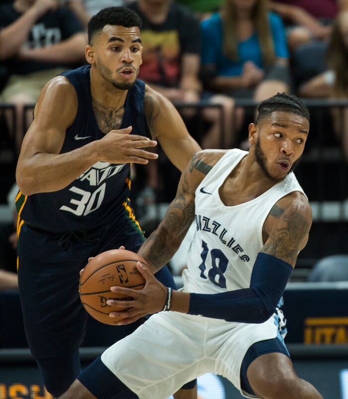 (Rick Egan  |  The Salt Lake Tribune)     Utah Jazz guard Naz Mitrou-Long (30) defends as Memphis Grizzlies guard Markel Crawford (18)drives inside, in Jazz summer league action between Utah Jazz and Memphis Grizzlies in Salt Lake City, Tuesday, July 3, 2018.
